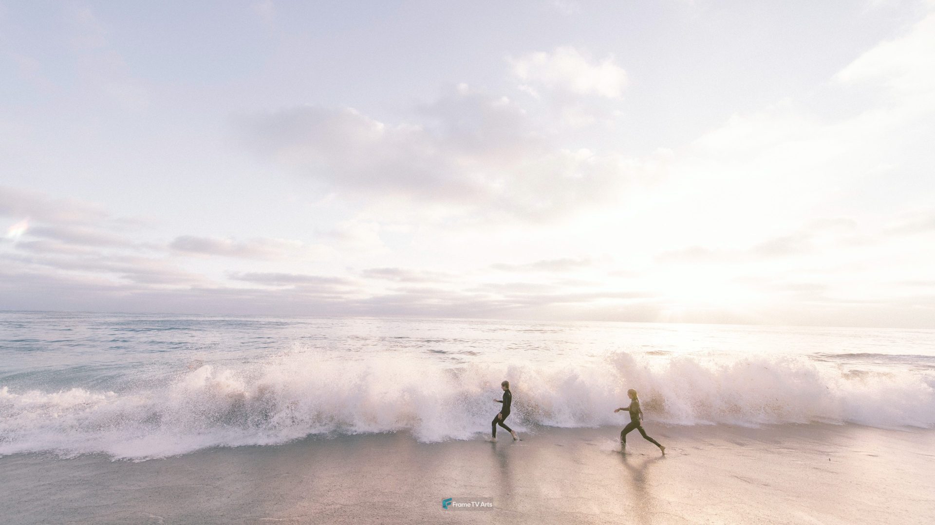 two person running on seaside beach during daytime — Samsung Frame TV art